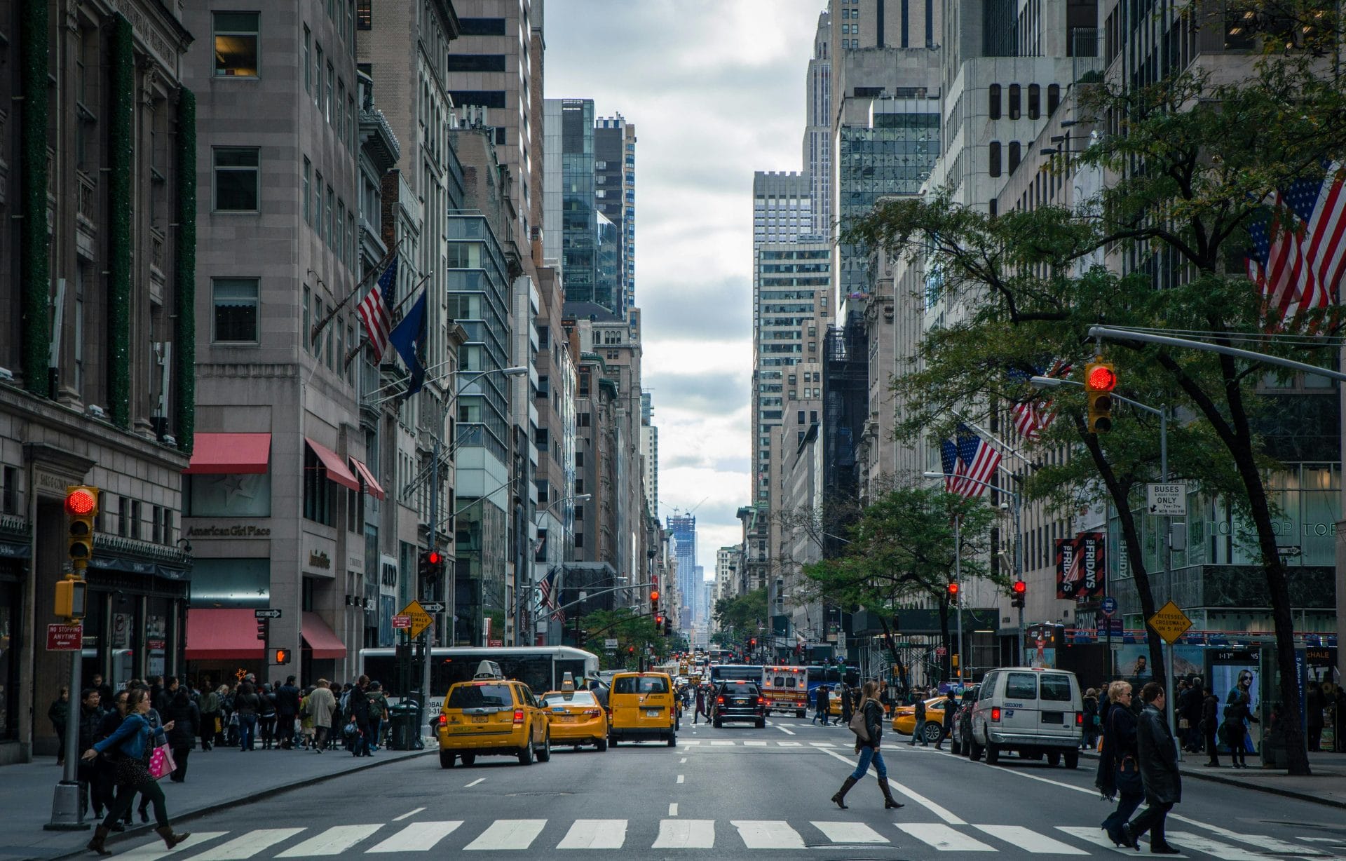 Street view of Manhattan, skyscrapers and yellow taxis flood the streets