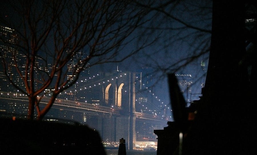 The Brooklyn Bridge is lit up during the filming of "I Am Legend"