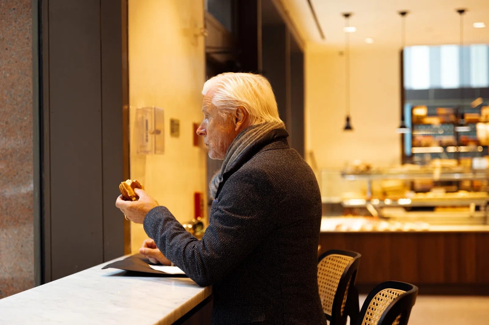 Man eating in L'Ami Pierre cafe
