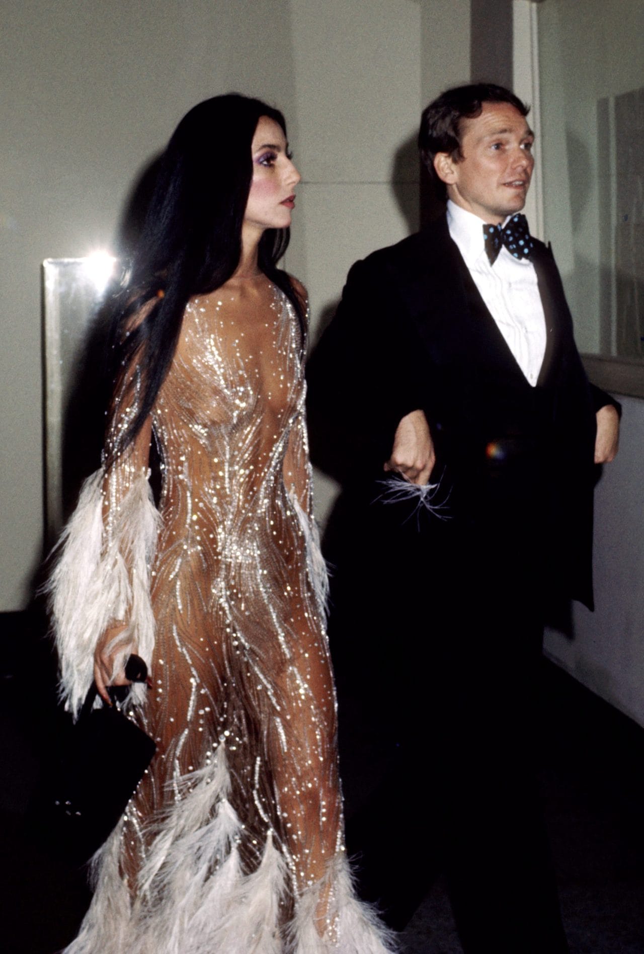 Cher wearing a beautiful see trough dress with fine rhinestones.