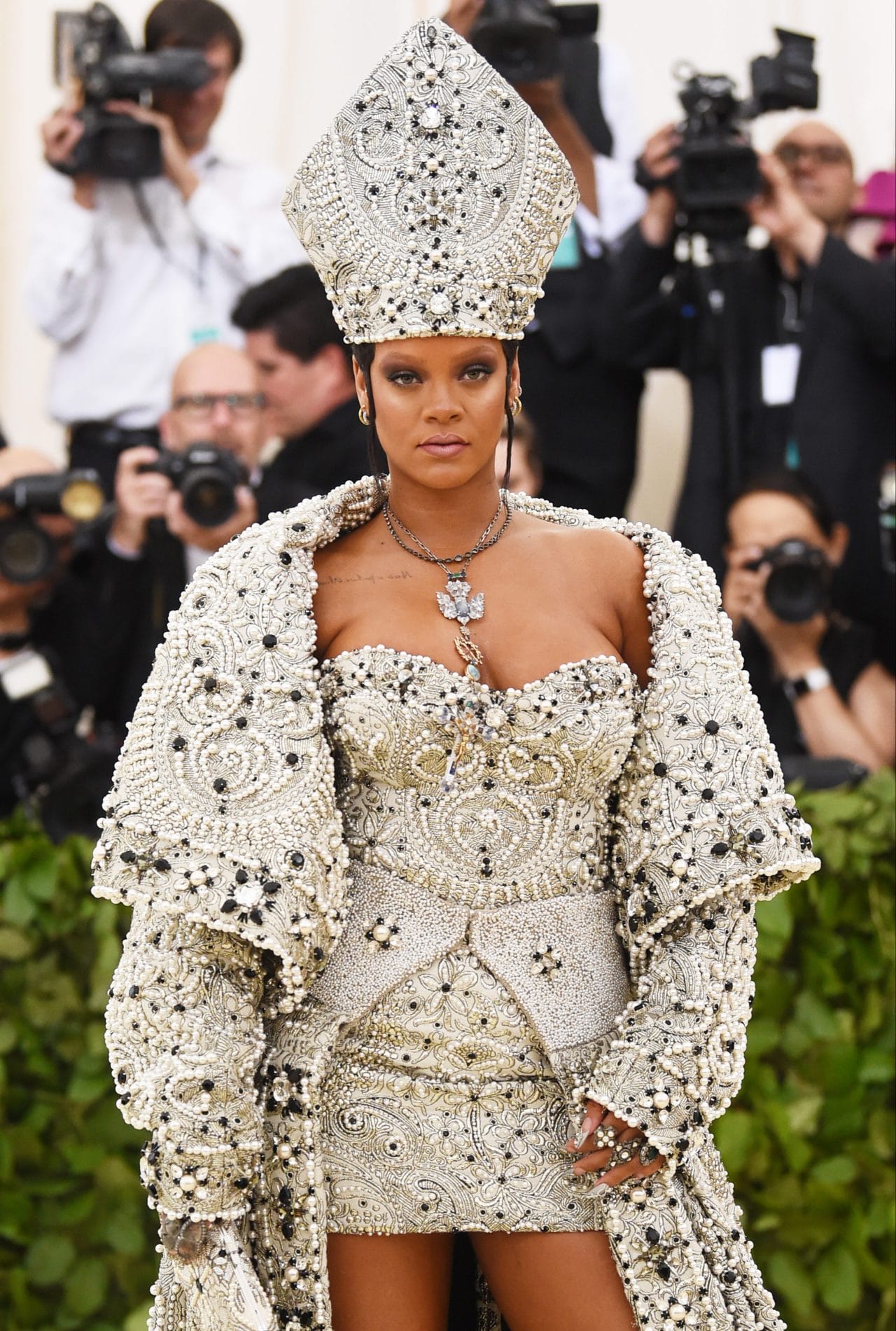 Rihanna silver crystal-covered looking like a pope