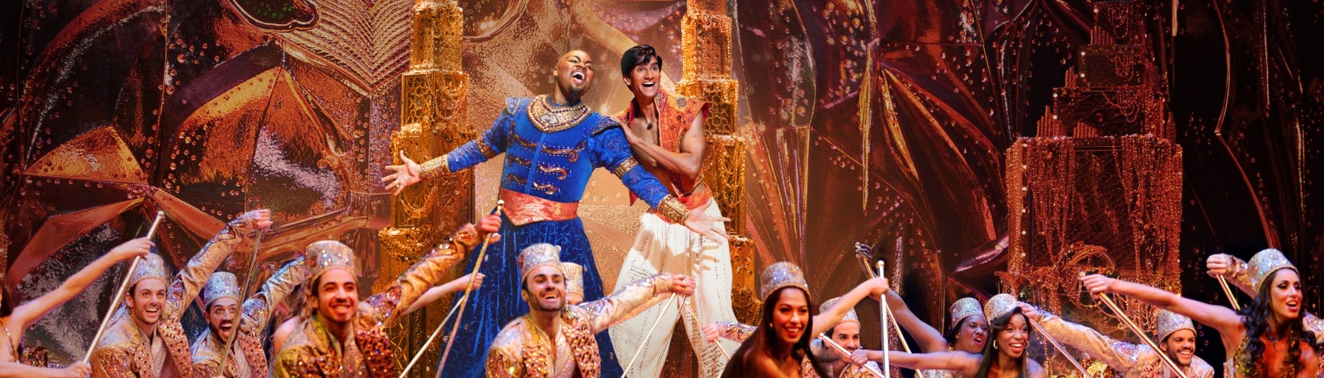 Actors from Aladdin on stage