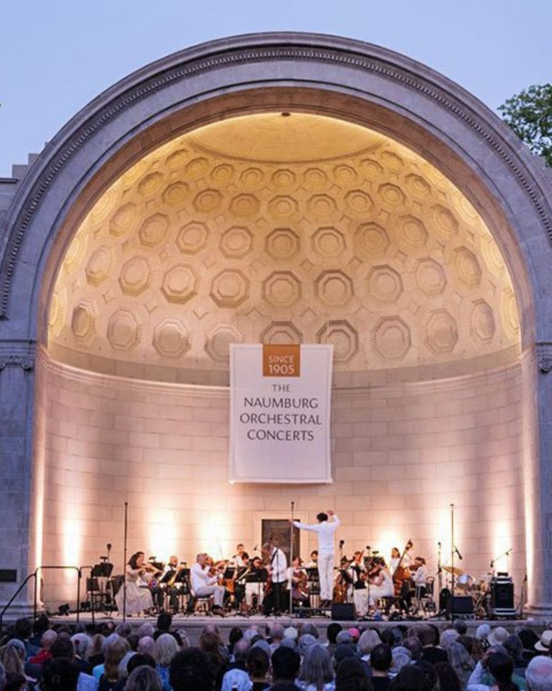 Naumburg Bandshell with the Naumburg Orchestra and a crowd.