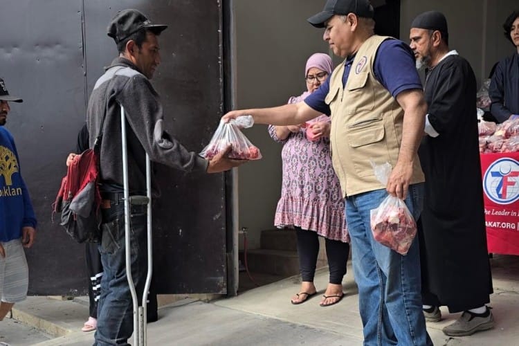 Zakat foundation team distributing Qurbani Meat to people.