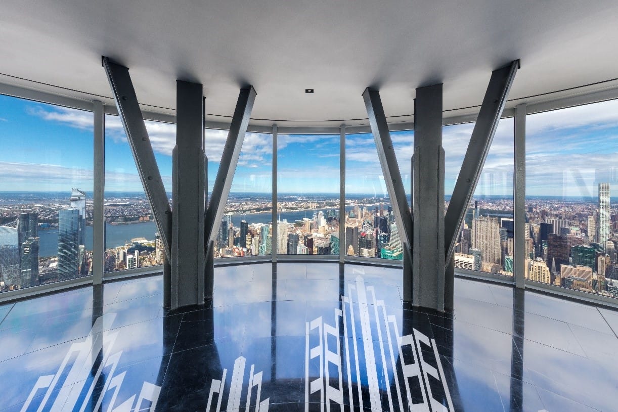 Wide shot of lobby in the Empire State Building that overlooks the city.