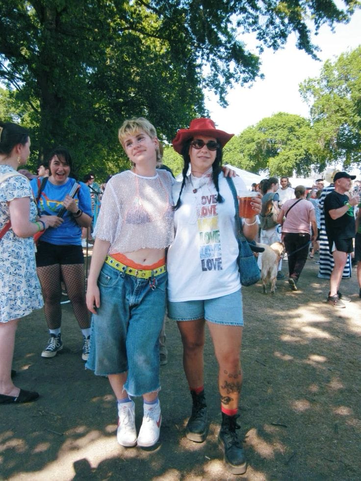Two people wearing denim shorts, styled with white tops and pops of colours.