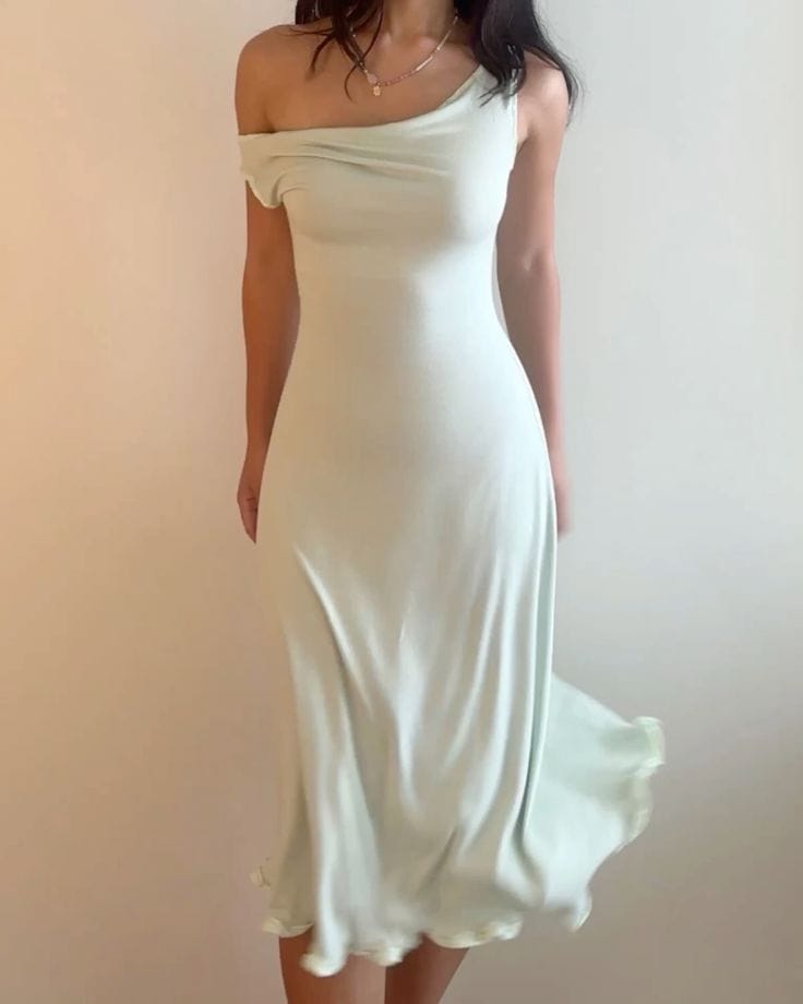 Someone wearing a cream coloured cocktail dress.