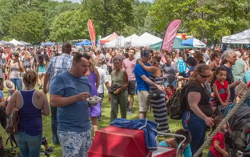 Wide shot of the Beacon Strawberry Festival, people gathering in a park.