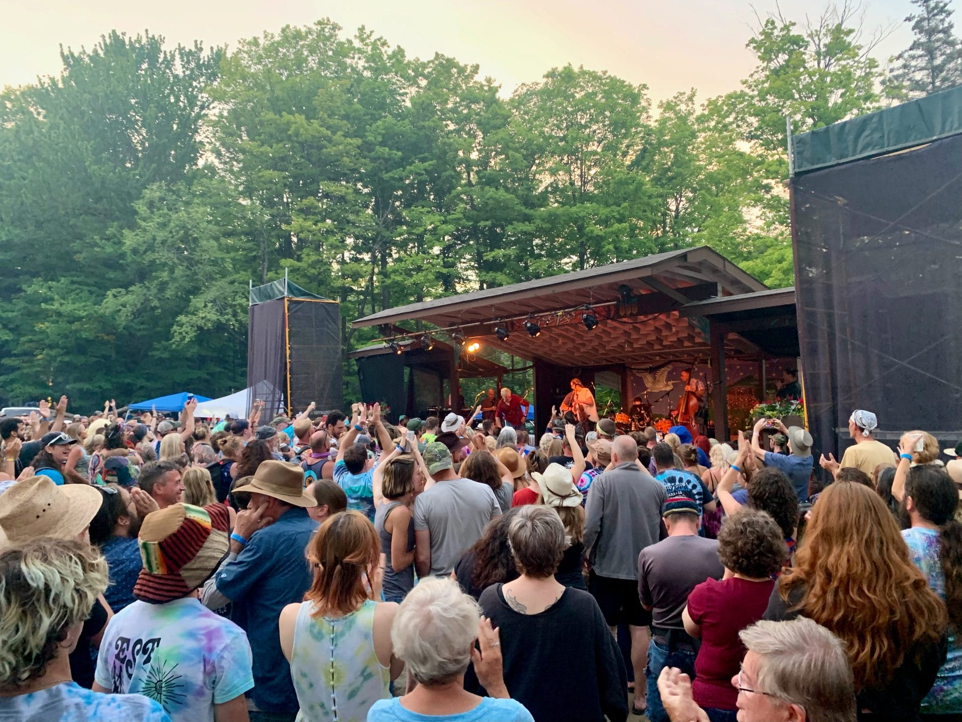People gathered around a stage performance.