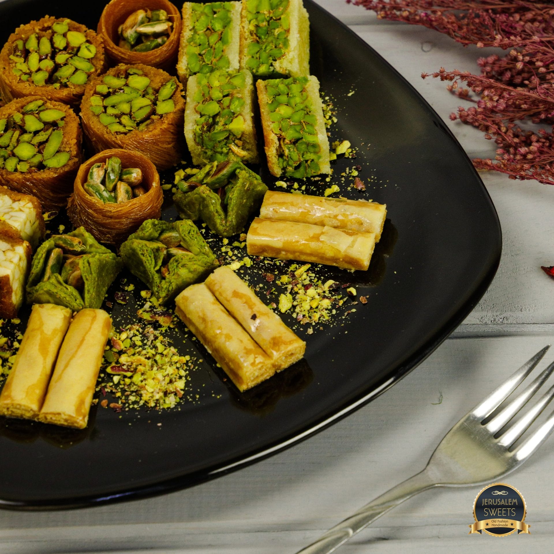 Baklava assortment on black plate