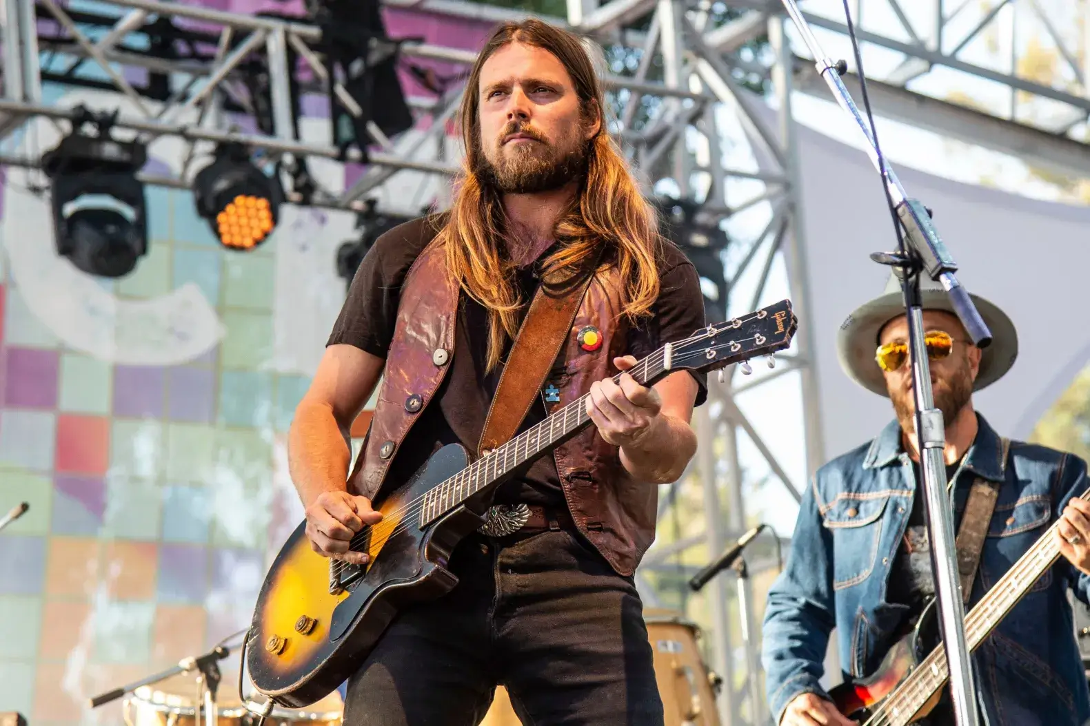 Musician Luka Nelson on stage with a guitar