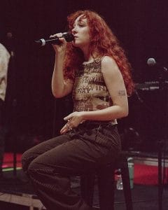 Chappell Roan performing live on stage during rehearsal ahead of her 2025 NYC pop-up concerts. Image via Instagram.